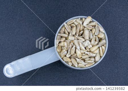 beautiful texture ripe of natural sunflower seeds on background beautiful texture ripe of natural sunflower seeds on background 141239382
