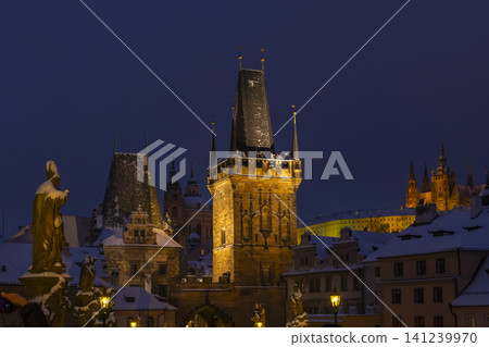 Snowy Lesser Town Bridge Tower in Prague at night Snowy Lesser Town Bridge Tower in Prague at night 141239970