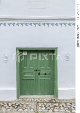 Traditional green wine cellar door in Palkonya, Hungary Traditional green wine cellar door in Palkonya, Hungary 141239987