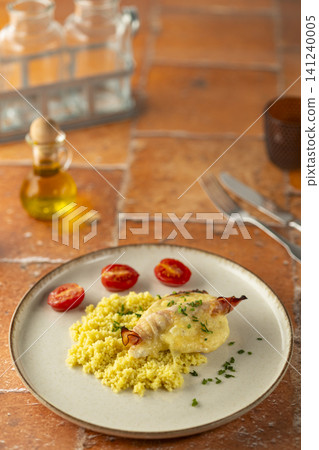 Chicken breast wrapped in ham with couscous and tomatoes Chicken breast wrapped in ham with couscous and tomatoes 141240005