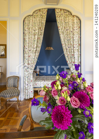 Floral arrangement decorating a luxurious French chateau interior Floral arrangement decorating a luxurious French chateau interior 141240209