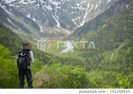Scenes of the lush green forests and tourists in Kamikochi, a popular tourist spot in early summer. Scenes of the lush green forests and tourists in Kamikochi, a popular tourist spot in early summer. 141240435