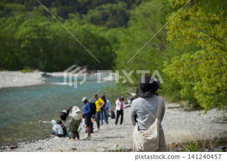 Scenes of the lush green forests and tourists in Kamikochi, a popular tourist spot in early summer. Scenes of the lush green forests and tourists in Kamikochi, a popular tourist spot in early summer. 141240457