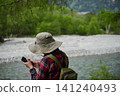 Scenes of the lush green forests and tourists in Kamikochi, a popular tourist spot in early summer. 141240493