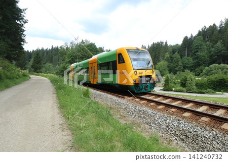 A train running through the Bavarian forest in Germany A train running through the Bavarian forest in Germany 141240732