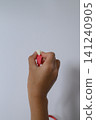 Hand of a person holding a LAN cable 141240905