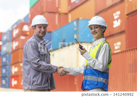 Business Team Cargo Container Shipping Inspection. Import and Export Freight at Port. Successful and accomplished work of teamwork Inspecting Containers Shipment. Shake hand and smile worker. Business Team Cargo Container Shipping Inspection. Import and Export Freight at Port. Successful and accomplished work of teamwork Inspecting Containers Shipment. Shake hand and smile worker. 141240992