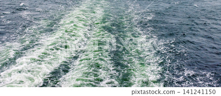 Foamy white wake trailing behind a passenger ferry on the Baltic Sea route between Helsinki, Finland, and Tallinn, Estonia. Foamy white wake trailing behind a passenger ferry on the Baltic Sea route between Helsinki, Finland, and Tallinn, Estonia. 141241150
