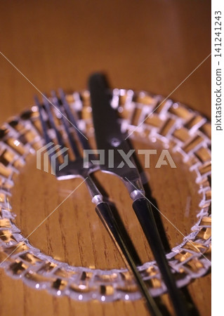 Fork and Knife on Decorative Glass Plate Fork and Knife on Decorative Glass Plate 141241243