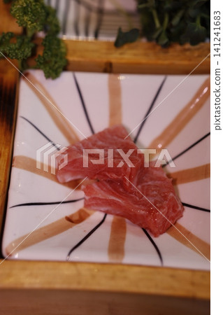 Raw Beef Slices on Decorative Plate Raw Beef Slices on Decorative Plate 141241683
