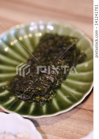 Seaweed Snack on Green Plate Seaweed Snack on Green Plate 141241701