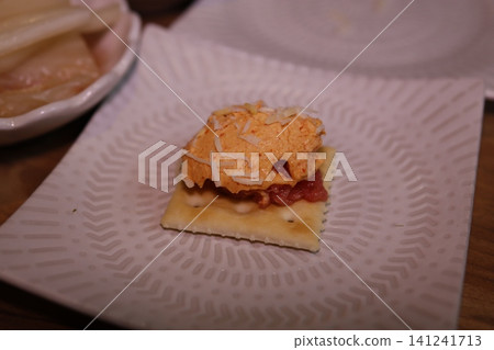 Cracker with Cheese and Tomato Spread Cracker with Cheese and Tomato Spread 141241713