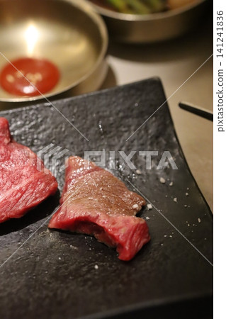 Raw Beef Slices on Slate Board with Salt Raw Beef Slices on Slate Board with Salt 141241836