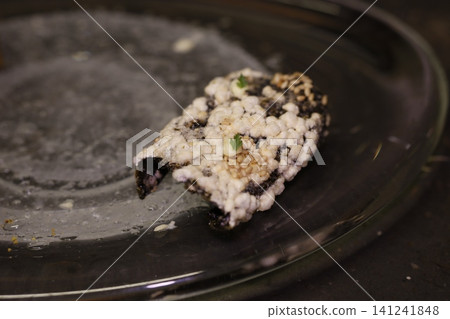 Sushi Piece with Sesame Seeds on Glass Plate Sushi Piece with Sesame Seeds on Glass Plate 141241848