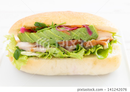 Delicious smoked chicken and avocado focaccia sandwich Delicious smoked chicken and avocado focaccia sandwich 141242076