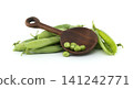 Fresh green peas in pods with a wooden spoon on a white background 141242771