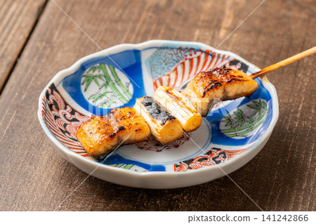 Eel and white onion skewers - a golden combination Eel and white onion skewers - a golden combination 141242866