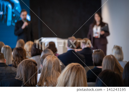Business conference audience listening to presenters at corporate seminar and networking event Business conference audience listening to presenters at corporate seminar and networking event 141243195