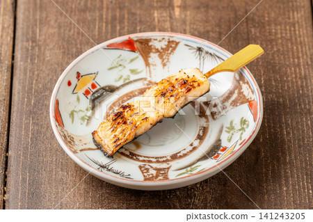 Eel skewers with a rich butter and soy sauce flavor Eel skewers with a rich butter and soy sauce flavor 141243205