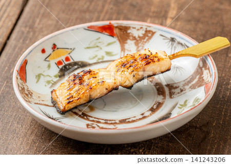 Eel skewers with a rich butter and soy sauce flavor Eel skewers with a rich butter and soy sauce flavor 141243206