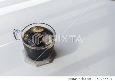A simple table photo of iced coffee; a summery image with space for copy. A simple table photo of iced coffee; a summery image with space for copy. 141243305