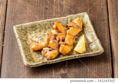 Fatty chicken tail grilled over charcoal Fatty chicken tail grilled over charcoal 141243507