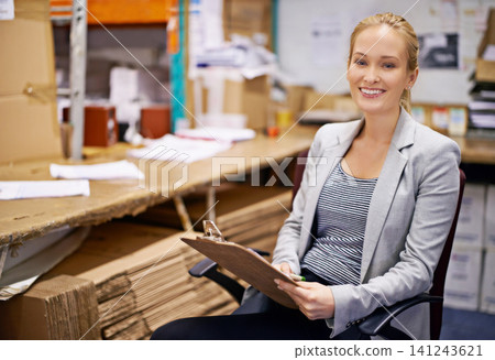 Business, portrait or woman with clipboard in warehouse office for logistics, planning or cargo checklist. Industry, supply chain or factory manager with compliance documents for cardboard recycling Business, portrait or woman with clipboard in warehouse office for logistics, planning or cargo checklist. Industry, supply chain or factory manager with compliance documents for cardboard recycling 141243621