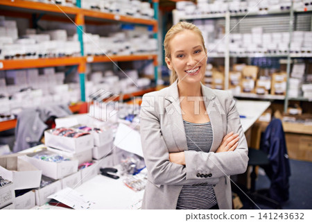 Happy woman, portrait and distributor with confidence at warehouse for storage, inventory or management. Confident, proud or young female person or employee with smile in distribution or supply chain Happy woman, portrait and distributor with confidence at warehouse for storage, inventory or management. Confident, proud or young female person or employee with smile in distribution or supply chain 141243632