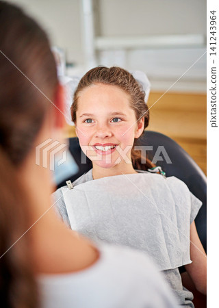 Happy, child and dentist at checkup appointment in clinic office for oral hygiene and health. Female, patient and orthodontist for braces, filling, cleaning and treatment on teeth from specialist Happy, child and dentist at checkup appointment in clinic office for oral hygiene and health. Female, patient and orthodontist for braces, filling, cleaning and treatment on teeth from specialist 141243964