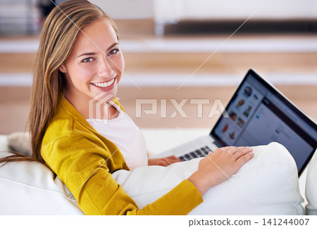 Portrait, happy and woman with laptop in living room for relax, social media or communication in apartment. Smile, face and female person for internet search, networking or typing on computer. 141244007