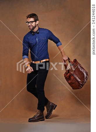 Fashion, bag and man in studio walking on background and mockup with briefcase for business vacation. Formal, style and luxury luggage for airport, journey to Italy or leather shoes with clothes 141244018