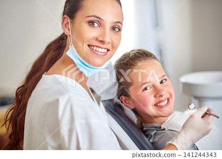 Portrait, dentist and happy child with woman in clinic for medical exam, orthodontics or cleaning teeth. Face, smile and dental doctor with kid for tooth care, oral health or pediatrician with mirror Portrait, dentist and happy child with woman in clinic for medical exam, orthodontics or cleaning teeth. Face, smile and dental doctor with kid for tooth care, oral health or pediatrician with mirror 141244343