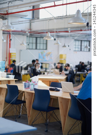 Desk, chairs and workplace for creative company, professional and copywriting people working. Laptop, technology and internet for research and typing for startup, table and wood for strong furniture Desk, chairs and workplace for creative company, professional and copywriting people working. Laptop, technology and internet for research and typing for startup, table and wood for strong furniture 141244345