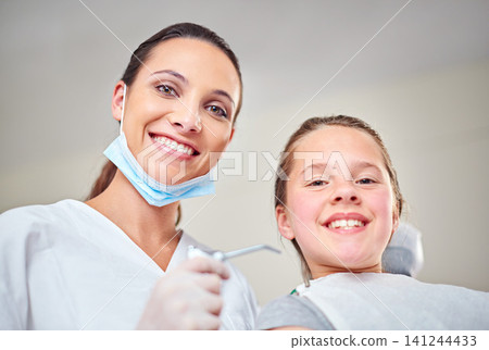 Woman, portrait and dentist for oral care or kid, suction and tool for treatment or hygiene. Female person, confidence and orthodontist for cleaning teeth, specialist and patient for gum health 141244433