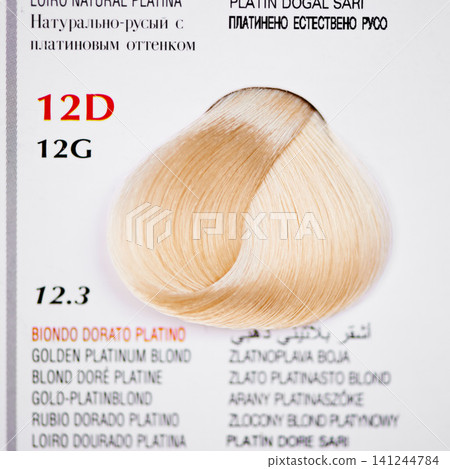 Hair color, blonde swatch and closeup at hairdresser for tone, shade and catalog for options with information. Display, palette and labels with description for choice, sample and decision at salon Hair color, blonde swatch and closeup at hairdresser for tone, shade and catalog for options with information. Display, palette and labels with description for choice, sample and decision at salon 141244784