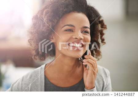 Black woman, happy and cellphone for phone call with conversation, communication and mobile at home. Closeup, female person and smile or satisfied on break for networking discussion and connection Black woman, happy and cellphone for phone call with conversation, communication and mobile at home. Closeup, female person and smile or satisfied on break for networking discussion and connection 141244887