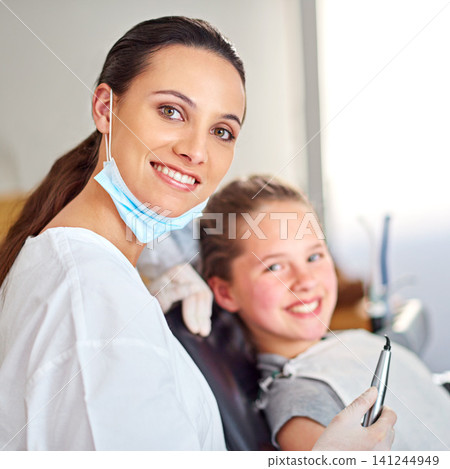 Portrait, dentist and woman with tools for happy child in medical exam, orthodontics or cleaning teeth. Face, smile and dental doctor with kid for tooth care, oral health or pediatrician with laser Portrait, dentist and woman with tools for happy child in medical exam, orthodontics or cleaning teeth. Face, smile and dental doctor with kid for tooth care, oral health or pediatrician with laser 141244949