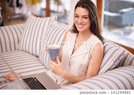 Portrait, woman and laptop with coffee for relaxing, happiness and weekend break on sofa. Smile, computer and female person for streaming movie, social media or browsing internet in apartment Portrait, woman and laptop with coffee for relaxing, happiness and weekend break on sofa. Smile, computer and female person for streaming movie, social media or browsing internet in apartment 141244991