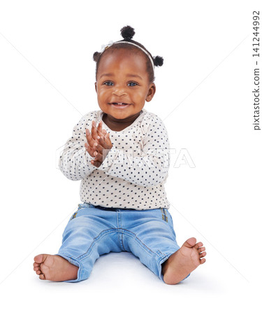 African baby and fashion in studio and clapping with smile, hands or fashionable or clothing. Little child on white background in portrait, fun or style or excited, happy or friendly and applause African baby and fashion in studio and clapping with smile, hands or fashionable or clothing. Little child on white background in portrait, fun or style or excited, happy or friendly and applause 141244992