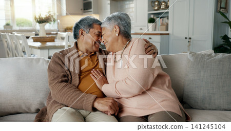 Senior couple, face and hug on sofa, smile and bonding with love, support and relax in retirement in home. Elderly woman, old man and happy with embrace, together and sitting on living room couch Senior couple, face and hug on sofa, smile and bonding with love, support and relax in retirement in home. Elderly woman, old man and happy with embrace, together and sitting on living room couch 141245104