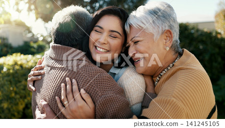 Mexican family, hug and smile for reunion, outdoors and love for support, retirement and care. Elderly parents and daughter, visit and happy in backyard, bonding and embrace for quality time at home 141245105