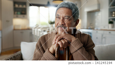 Thinking, depression and senior man with walking stick on chair with Alzheimer, memory loss or lonely. Face, anxiety and elderly male with a disability and mobility cane in living room sad or stress Thinking, depression and senior man with walking stick on chair with Alzheimer, memory loss or lonely. Face, anxiety and elderly male with a disability and mobility cane in living room sad or stress 141245194