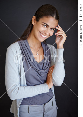 Portrait, smile and business woman in studio isolated on dark background for workplace employee. Confident female person, profession and office career or administrative position in startup company. Portrait, smile and business woman in studio isolated on dark background for workplace employee. Confident female person, profession and office career or administrative position in startup company. 141245202