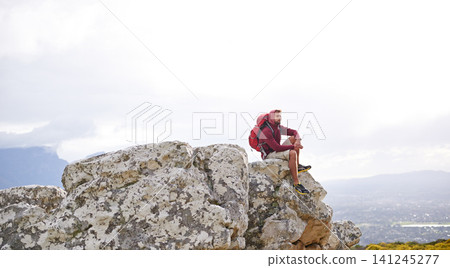 Man, mountain and relax on outdoor hike in nature, workout and peace or calm on rocks for wellness. Male person, exercise and travel with backpack on vacation, adventure and explore bush for fitness Man, mountain and relax on outdoor hike in nature, workout and peace or calm on rocks for wellness. Male person, exercise and travel with backpack on vacation, adventure and explore bush for fitness 141245277