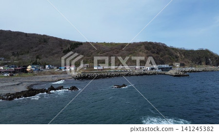 Drone aerial footage of the Yoichi River estuary from above, Shakotan Town, Hokkaido. Drone aerial footage of the Yoichi River estuary from above, Shakotan Town, Hokkaido. 141245382