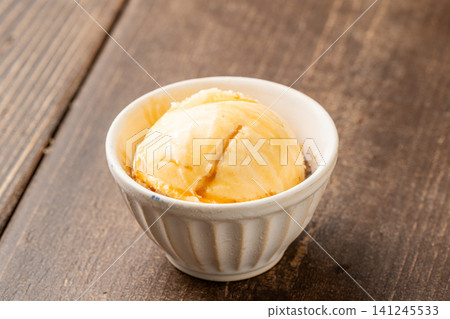 Classic dessert: cold vanilla ice cream Classic dessert: cold vanilla ice cream 141245533