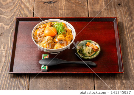 Oyakodon (chicken and egg rice bowl) with plenty of chicken and egg flavor Oyakodon (chicken and egg rice bowl) with plenty of chicken and egg flavor 141245927