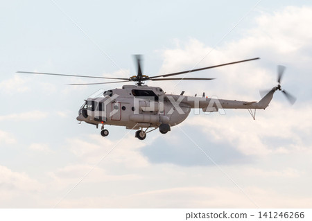 A white multi-purpose helicopter flies in the sky A white multi-purpose helicopter flies in the sky 141246266