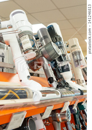 A Close Look at a Variety of Handheld Vacuum Cleaners on Display in a Retail Store Setting A Close Look at a Variety of Handheld Vacuum Cleaners on Display in a Retail Store Setting 141246813