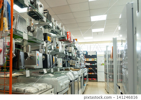Aisle of Kitchen Appliances Showcasing a Range of Modern Equipment for Cooking, Refrigeration, and Food Preparation in a Retail Setting Aisle of Kitchen Appliances Showcasing a Range of Modern Equipment for Cooking, Refrigeration, and Food Preparation in a Retail Setting 141246816